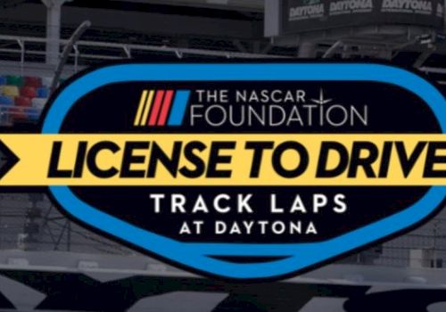 The image shows a sign for "The NASCAR Foundation License to Drive: Track Laps at Daytona."