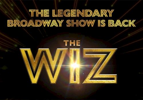 A promotional graphic reading &ldquo;The Legendary Broadway Show Is Back&rdquo; featuring &ldquo;THE WIZ&rdquo; with gold letters on a dark spotlight background.