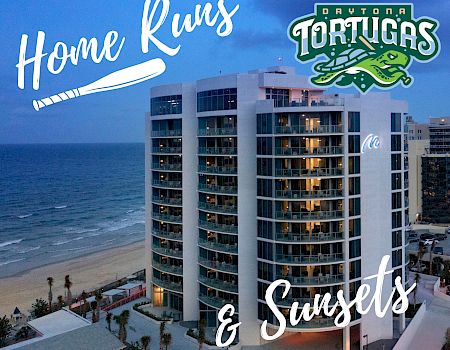 A beachfront condo complex in Daytona with the words &ldquo;Home Runs&rdquo; and &ldquo;Tortugas&rdquo; graphic, promoting a home run event in Daytona Beach, FL.
